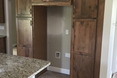Utility room cabinets - husk finish on rustic alder